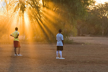 Image showing players at the sunset