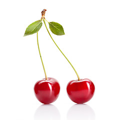 Image showing Red cherry with leaves isolated on white