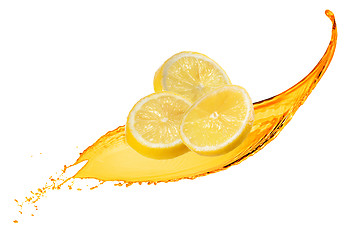 Image showing Falling slices of lemon with juice splash isolated on white