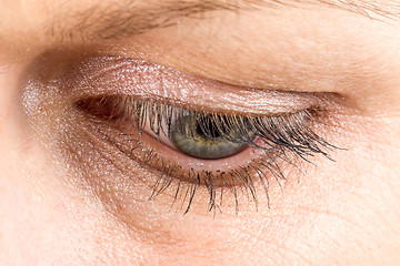 Image showing middle age woman eye macro