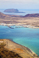 Image showing miramar del rio harbor rock beach  boat     in lanzarote spain 