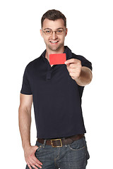 Image showing Male in eyeglasses giving you red credit card