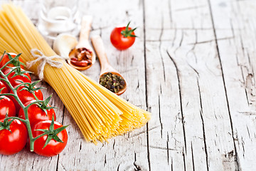 Image showing uncooked pasta with tomatoes and spices