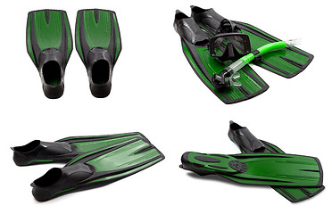 Image showing Set of green swim fins, mask, snorkel for diving with water drop