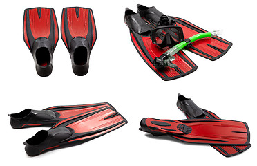 Image showing Set of red swim fins, mask, snorkel for diving with water drops