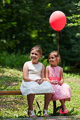 Image showing Two girls in park