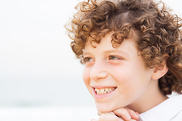 Image showing Young pretty boy posing at beach