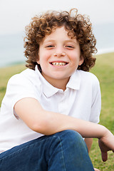 Image showing Smiling young boy posing casually 