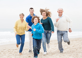 Image showing Happy family jogging atthe beach