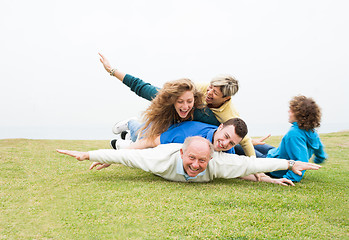 Image showing Happy family playing at park