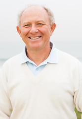 Image showing Smiling senior man posing in beach