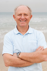 Image showing Confident senior citizen posing at beach