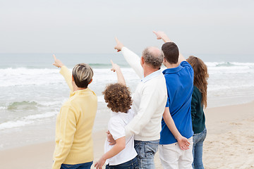 Image showing Back view of beautiful family on vacation