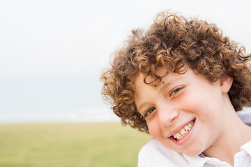 Image showing Smiling young pretty boy posing