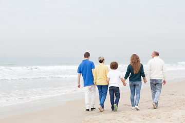 Image showing Happy family walking on beach