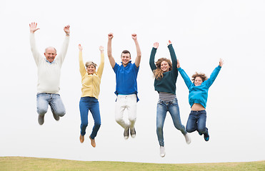 Image showing Family jumping on the air at park