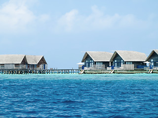 Image showing Water villa cottages on island