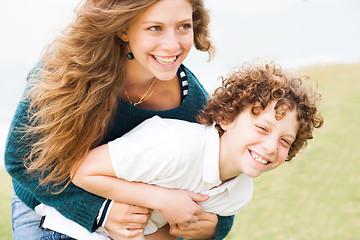 Image showing Happy mother and son playing