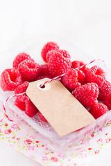 Image showing Fresh raspberries and cardboard tag