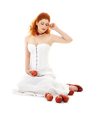 Image showing lovely redhead in red shoes with apples