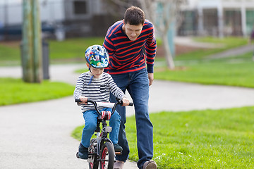 Image showing family biking