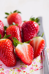 Image showing Fresh strawberries and knife