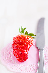 Image showing Sliced strawberry and knife