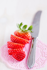 Image showing Sliced strawberry and knife