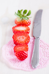 Image showing Sliced strawberry and knife