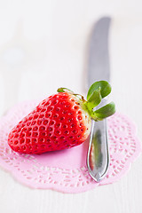 Image showing Fresh whole strawberry and knife