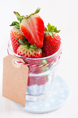 Image showing Fresh strawberries in glass with tag