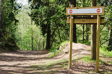 Image showing Wooden sign board on the natural trail. In the 
 forest park