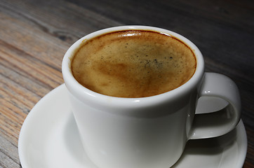 Image showing cup of espresso coffee on wooden board