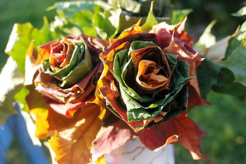 Image showing two roses woven of fall leaves