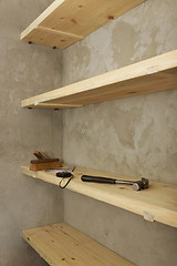 Image showing Solid shelves made of wood in rural pantry