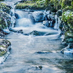 Image showing Small creek with a waterfall close up