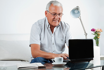 Image showing Senior Man Working on Laptop