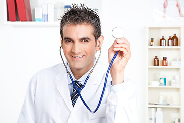 Image showing Male Doctor Holding Stethoscope