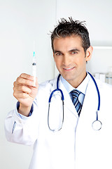 Image showing Male Doctor Holding Syringe