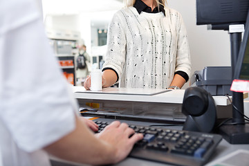 Image showing Customer Standing at Checkout Counter