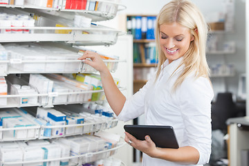 Image showing Female Chemist Standing in Pharmacy Drugstore