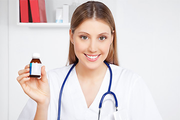 Image showing Doctor Holding Medicine Bottle