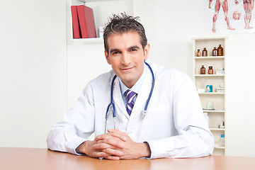 Image showing Male Doctor Sitting at Desk