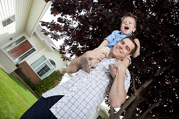 Image showing Portrait of Young Father and Son Outdoors