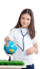 Image showing Girl with Stethoscope and Globe