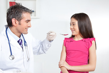 Image showing Doctor Giving Medicine to Girl