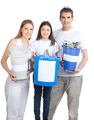 Image showing Family Holding Recycle Bin