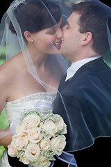 Image showing Newlywed Couple Kissing