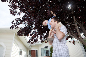 Image showing Portrait Of Boy Sitting On Father's Shoulder