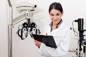 Image showing Smiling Young Optometrist With Clipboard